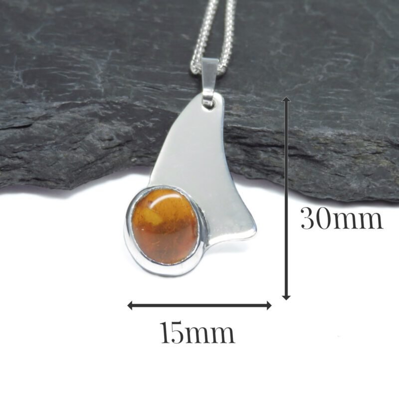 C256 - Sterling silver and Amber pendant. Measures 30x15mm