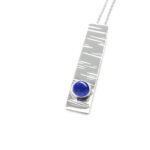 B214-sterling silver and lapis lazuli pendant. Measures 30x7mm with 5mm gemstone