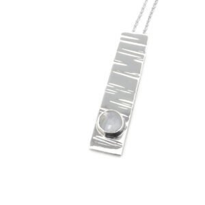 B214-sterling silver and Moonstone pendant. Measures 30x7mm with 5mm gemstone