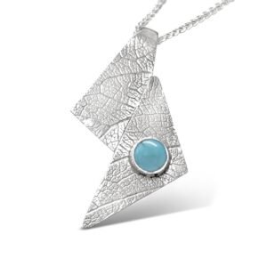 L541-sterling silver and Chinese Turquoise pendant. Measures 39 x 20mm