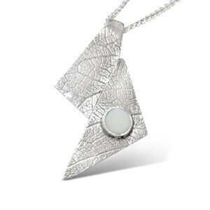 L541-sterling silver and Opal pendant. Measures 39 x 20mm